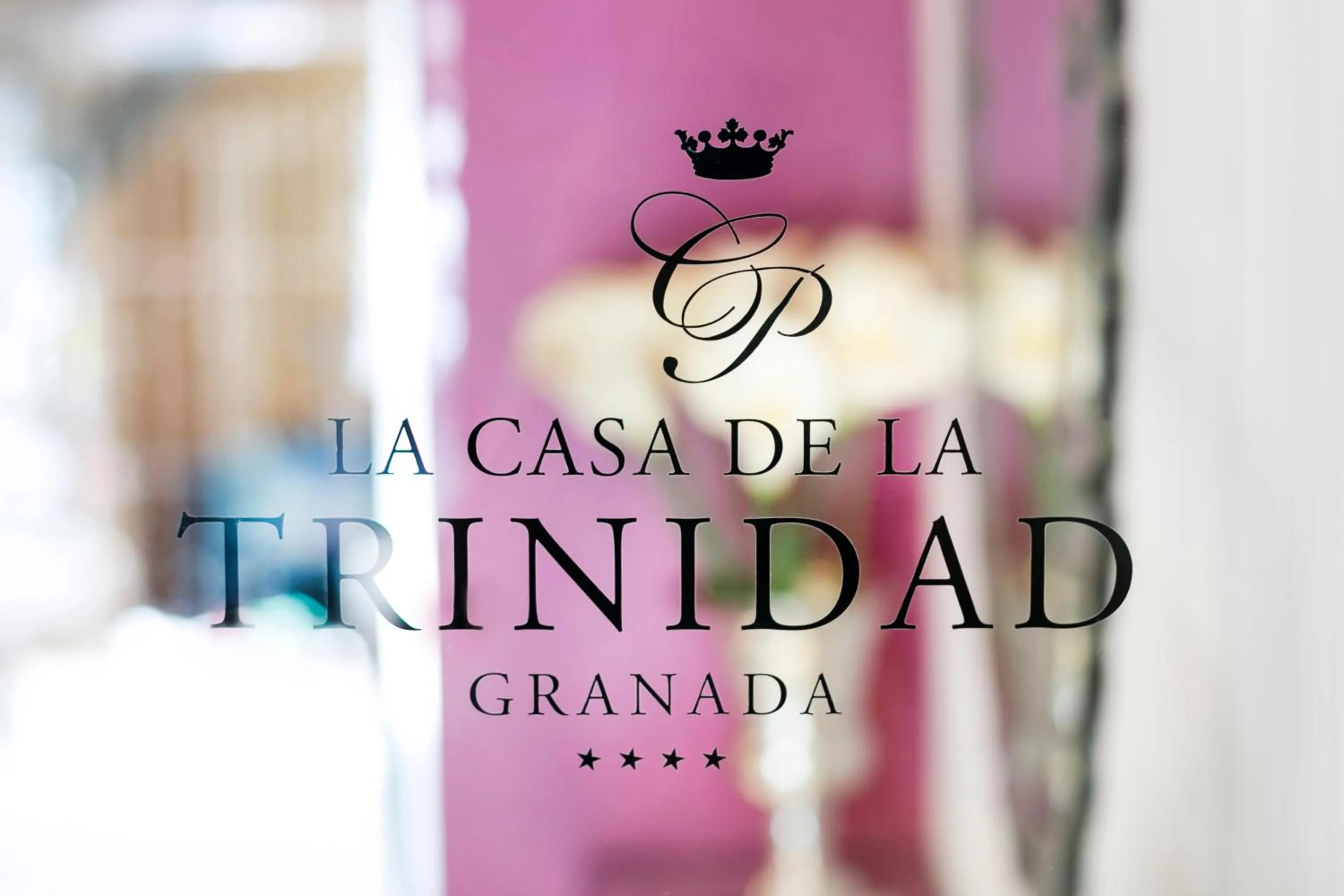 Property logo or sign in La Casa de la Trinidad