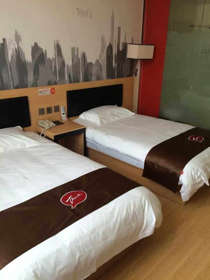 Bed in JUNYI Hotel Jiangsu Nanjing University of Information Science and Technology
