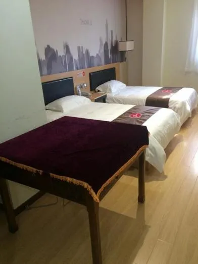 Bed in JUNYI Hotel Jiangsu Nanjing University of Information Science and Technology