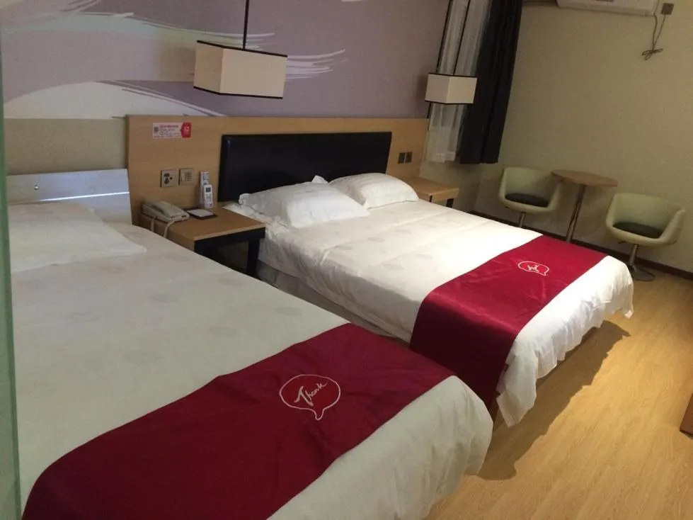 Bed in JUNYI Hotel Jiangsu Nanjing University of Information Science and Technology