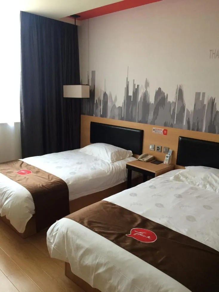 Bed in JUNYI Hotel Jiangsu Nanjing University of Information Science and Technology