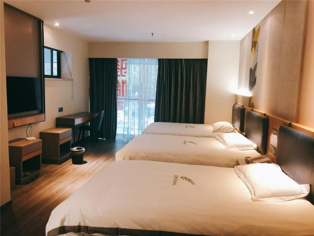 Bed in JUNYI Hotel Nanjing Olympic Sports Center