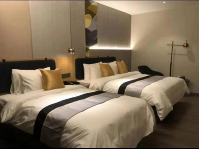 Bed in JUNYI Hotel Nanjing Olympic Sports Center