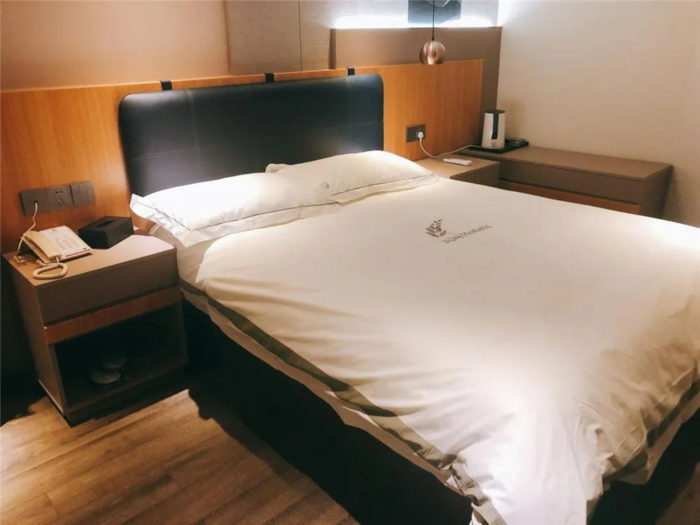 Bed in JUNYI Hotel Nanjing Olympic Sports Center