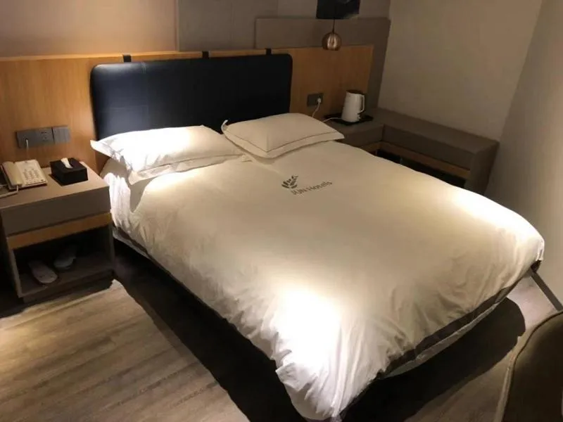 Bed in JUNYI Hotel Nanjing Olympic Sports Center