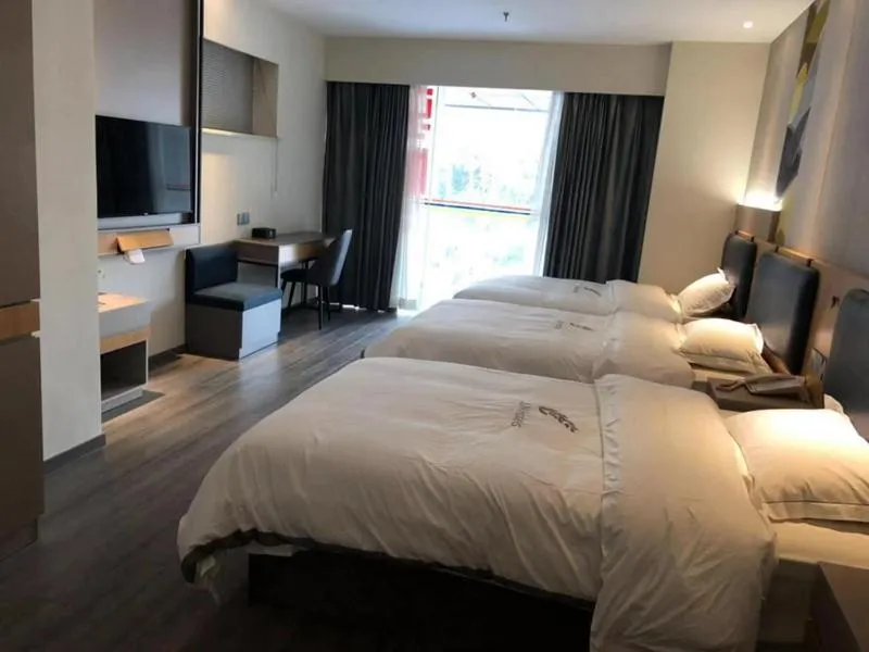 Bed in JUNYI Hotel Nanjing Olympic Sports Center