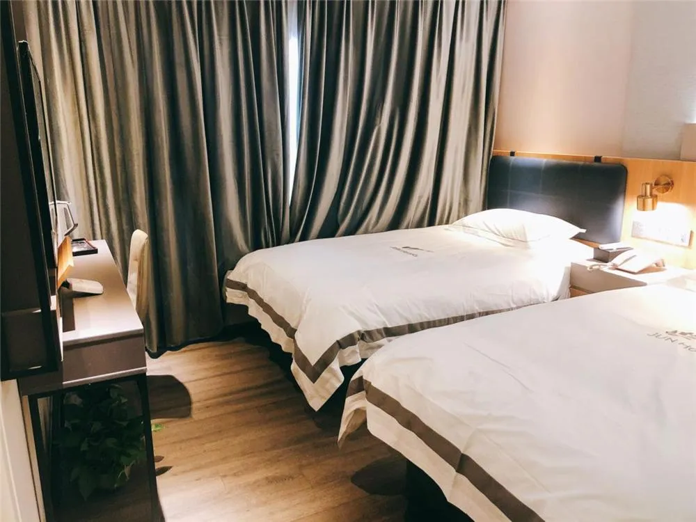Bed in JUNYI Hotel Nanjing Olympic Sports Center