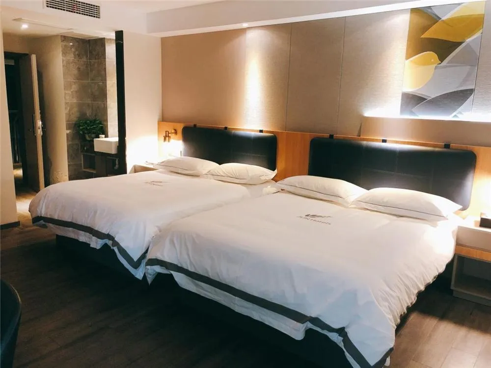 Bed in JUNYI Hotel Nanjing Olympic Sports Center