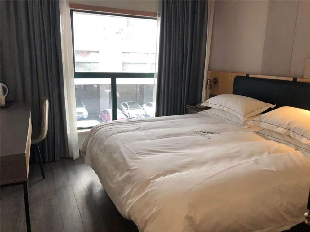 Bed in JUNYI Hotel Nanjing Olympic Sports Center