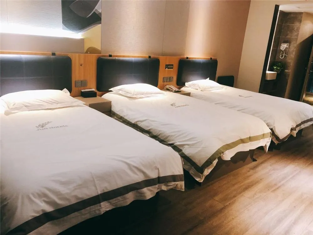 Bed in JUNYI Hotel Nanjing Olympic Sports Center