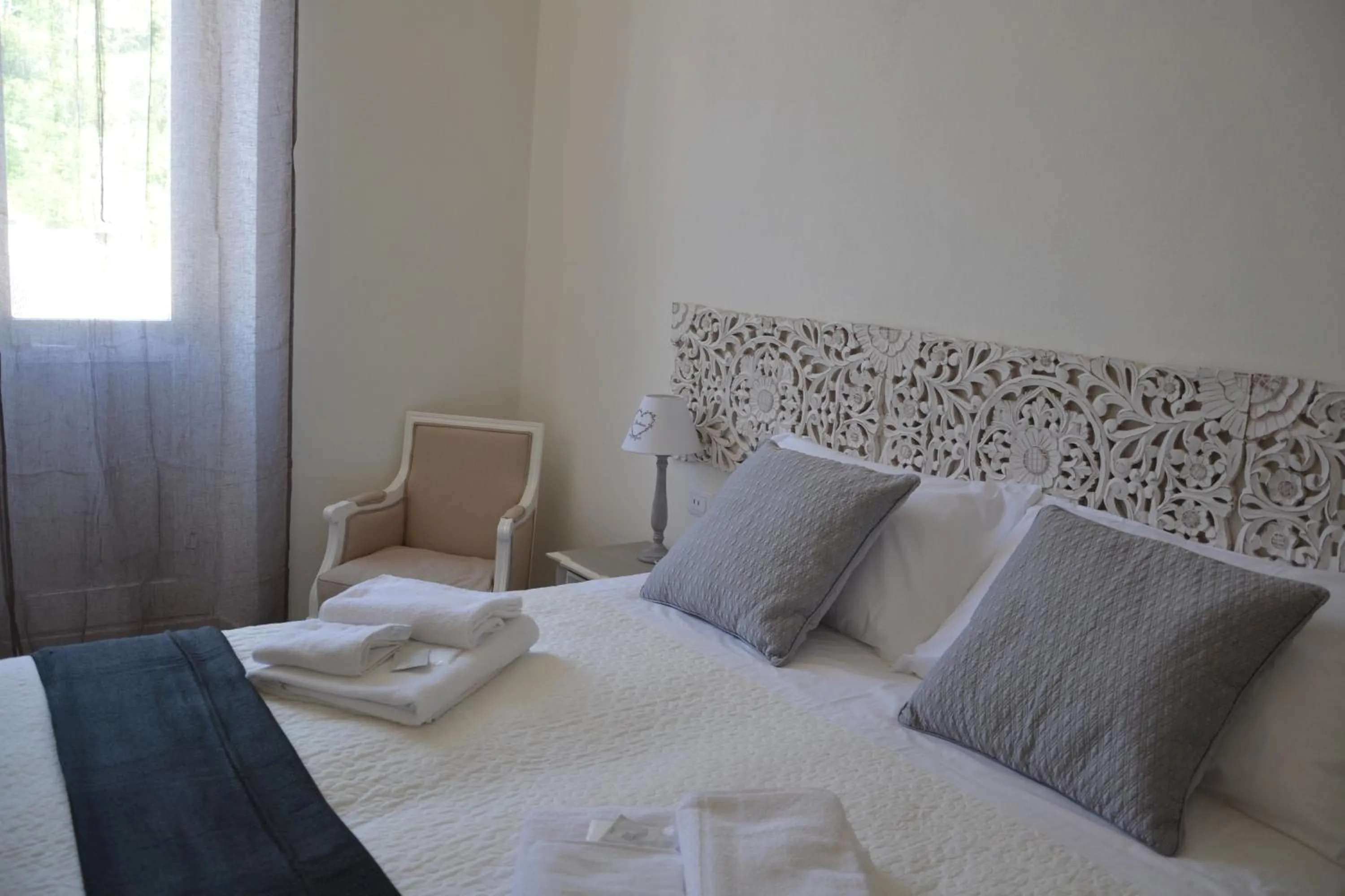 Decorative detail, Bed in Affittacamere Casa Dane'