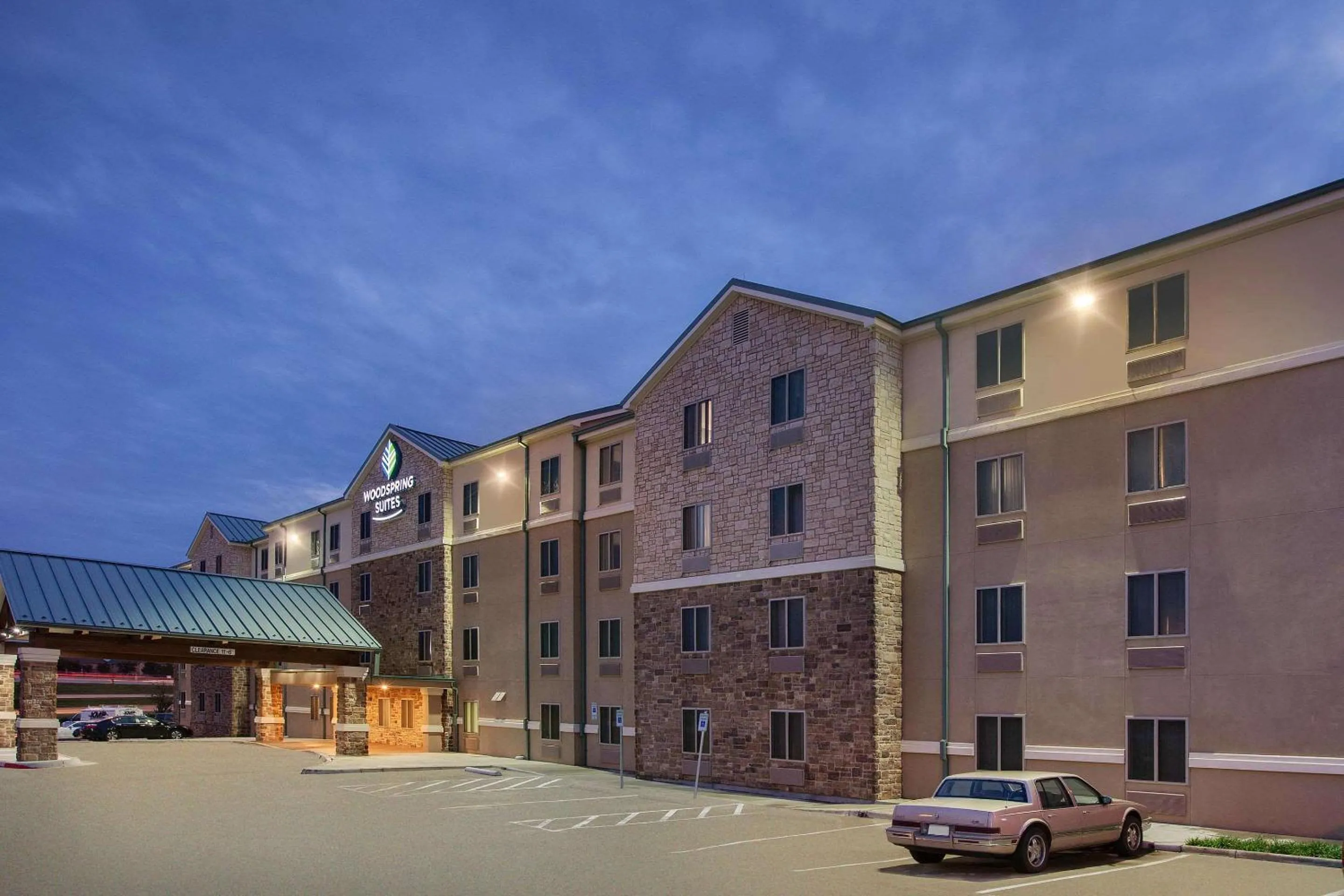 Property building in WoodSpring Suites Las Colinas - Northwest Dallas