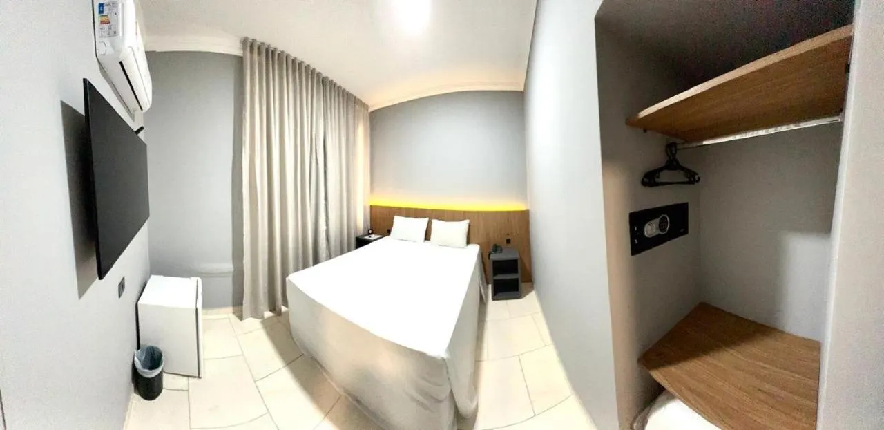 Bed in HOTEL DEL REY CURITIBA by POTY - NA FAMOSA RUA XV DE NOVEMBRO