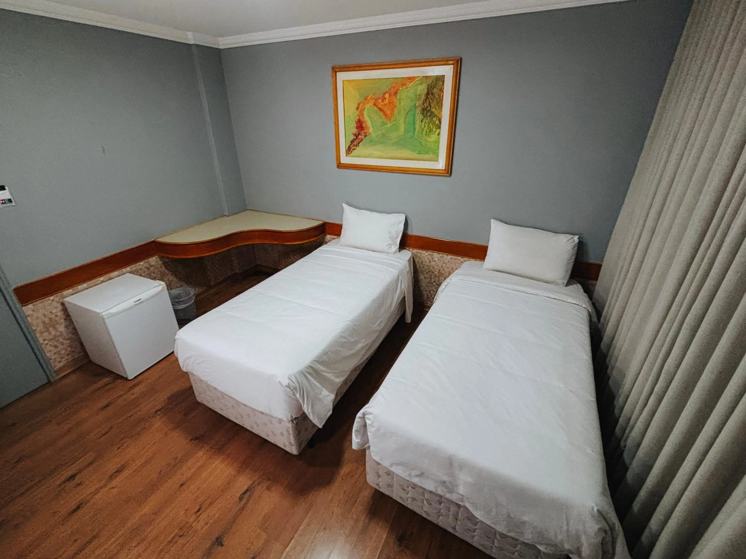 Bed in HOTEL DEL REY CURITIBA by POTY - NA FAMOSA RUA XV DE NOVEMBRO