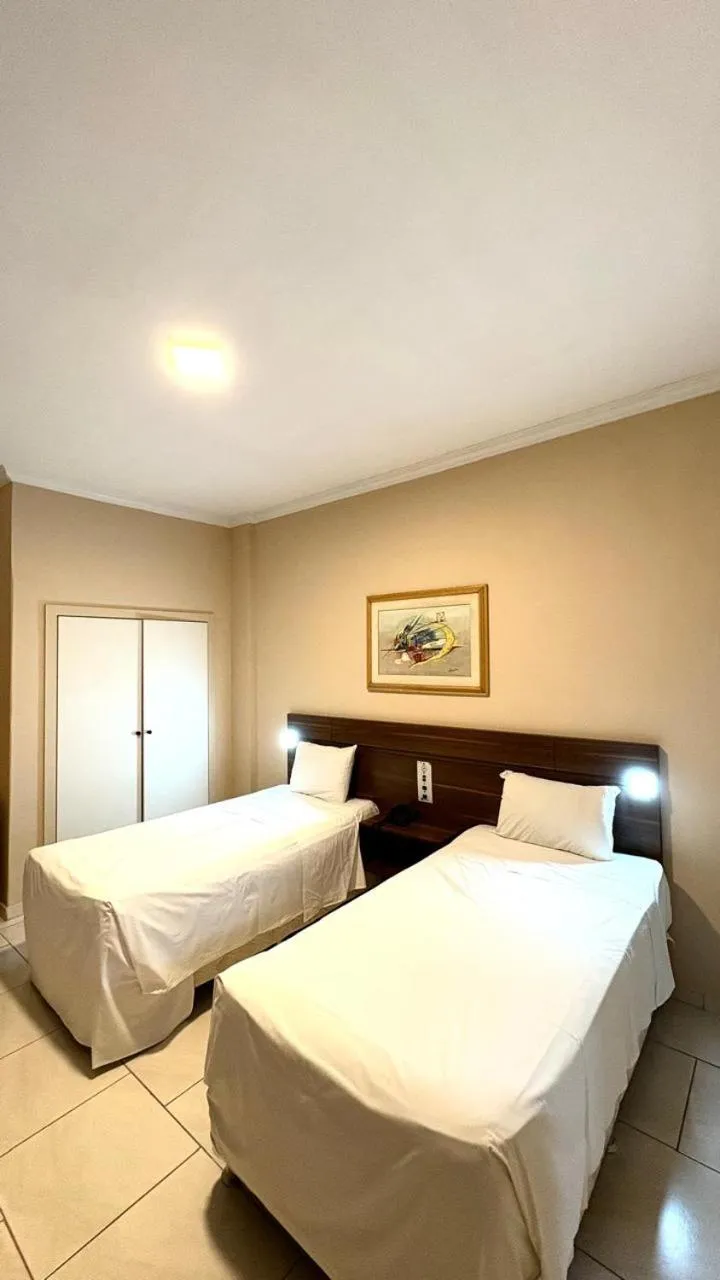 Bed in HOTEL DEL REY CURITIBA by POTY - NA FAMOSA RUA XV DE NOVEMBRO