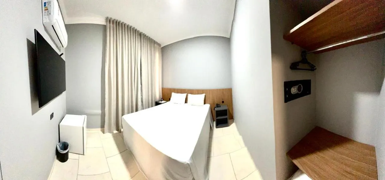 Bed in HOTEL DEL REY CURITIBA by POTY - NA FAMOSA RUA XV DE NOVEMBRO