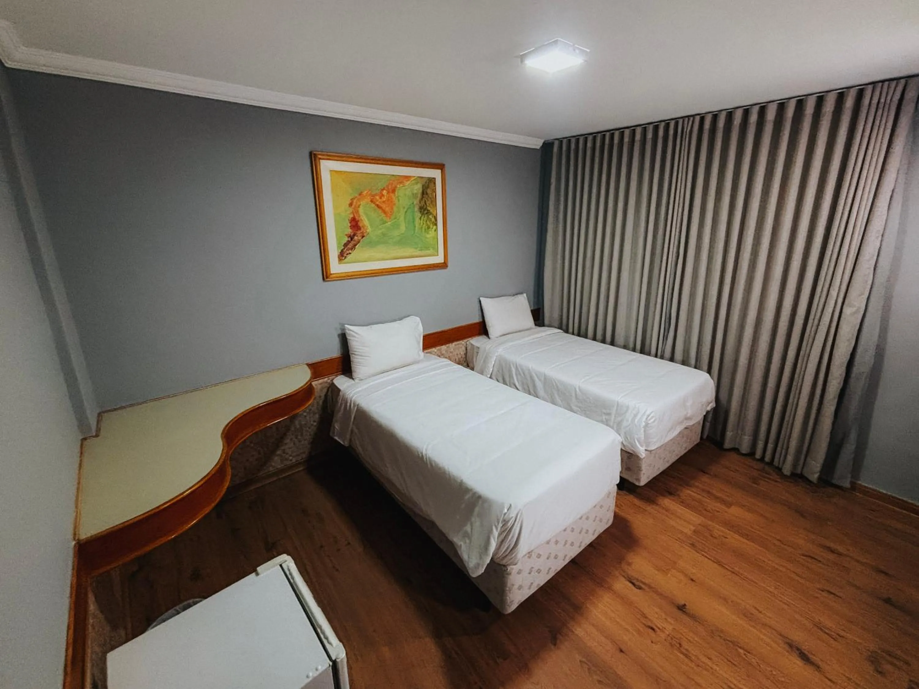 Bed in HOTEL DEL REY CURITIBA by POTY - NA FAMOSA RUA XV DE NOVEMBRO