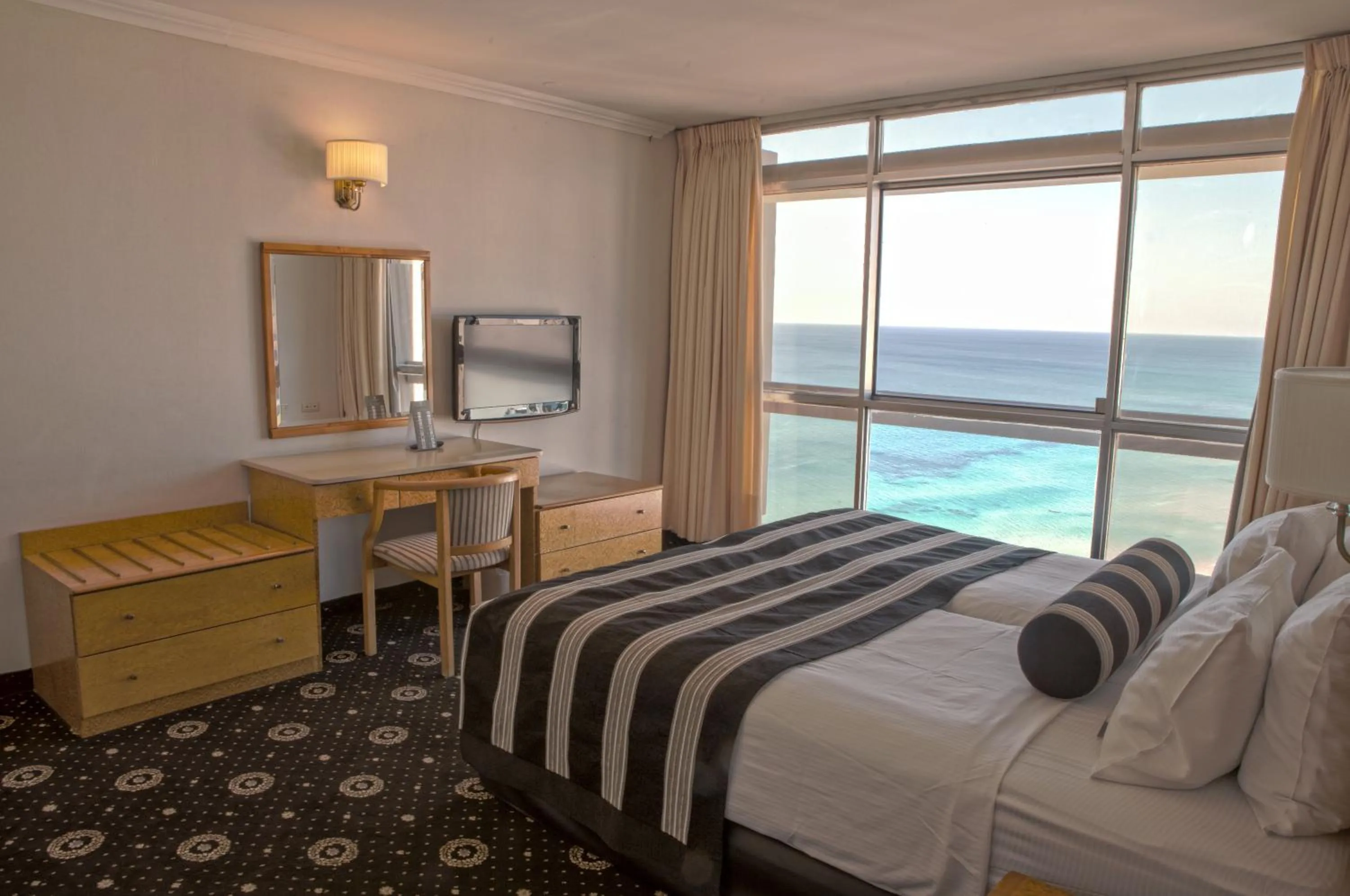 Bed in The Seasons Hotel -Studio & Suite