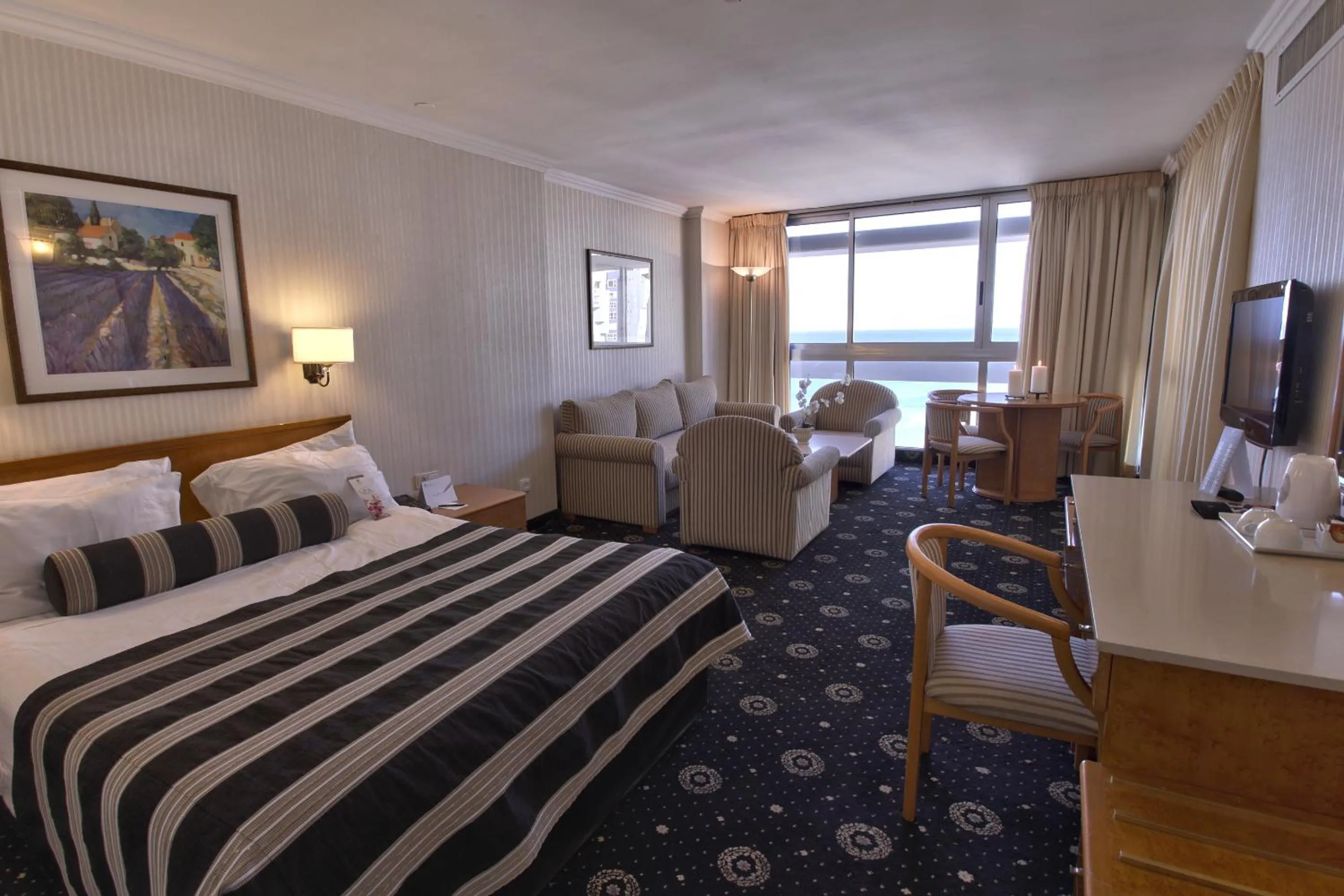 Bed in The Seasons Hotel -Studio & Suite