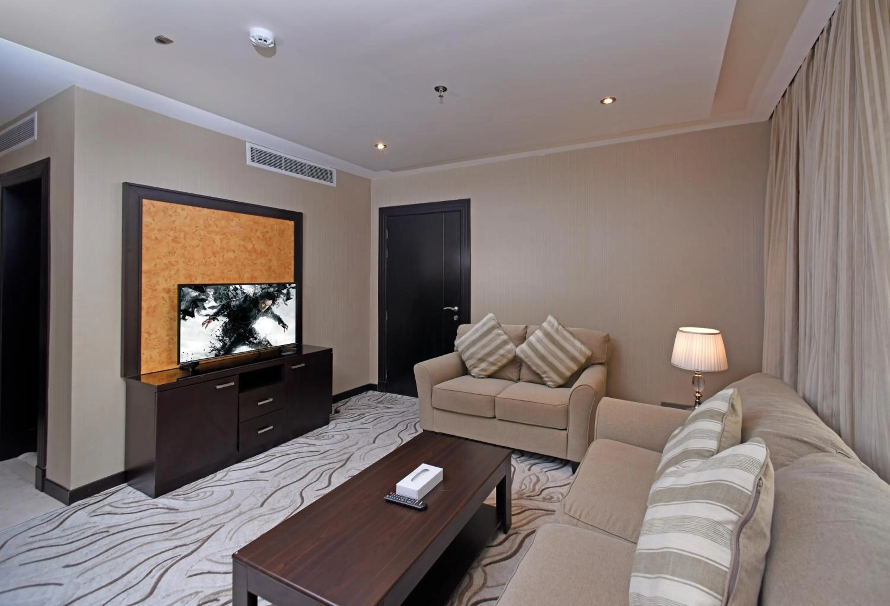 Communal lounge/ TV room in Naviti Warwick Al Khobar