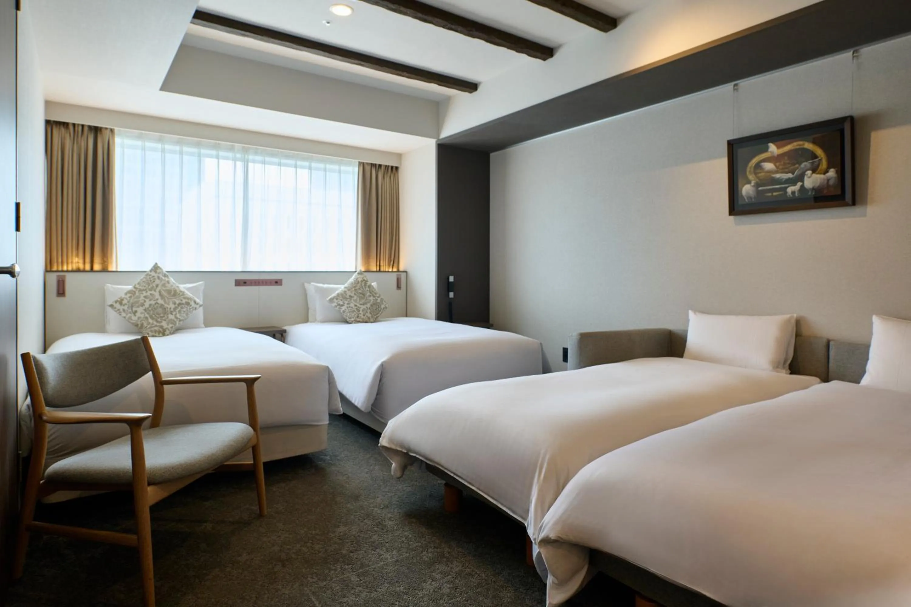 Bed in Cross Hotel Sapporo