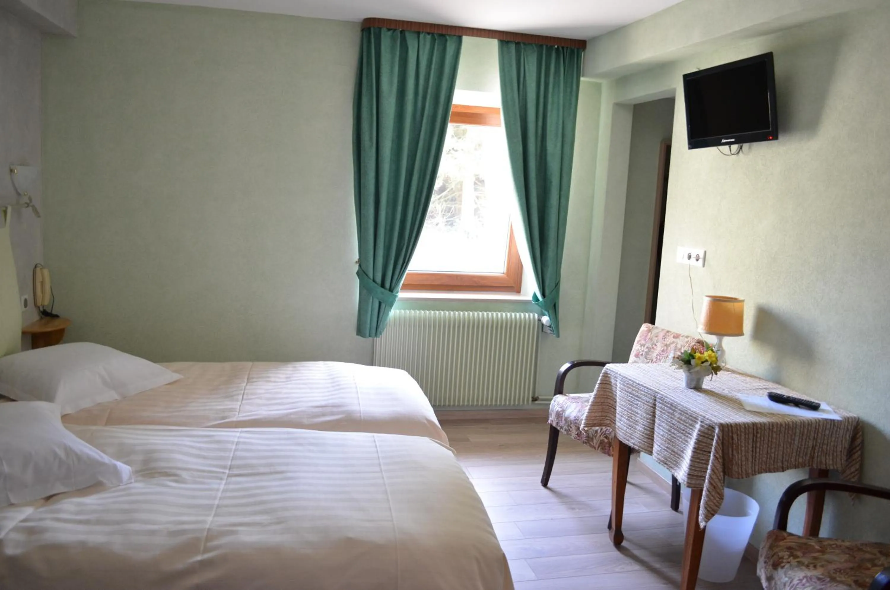 Bed in Logis Hotel & Restaurant - Les Vosges