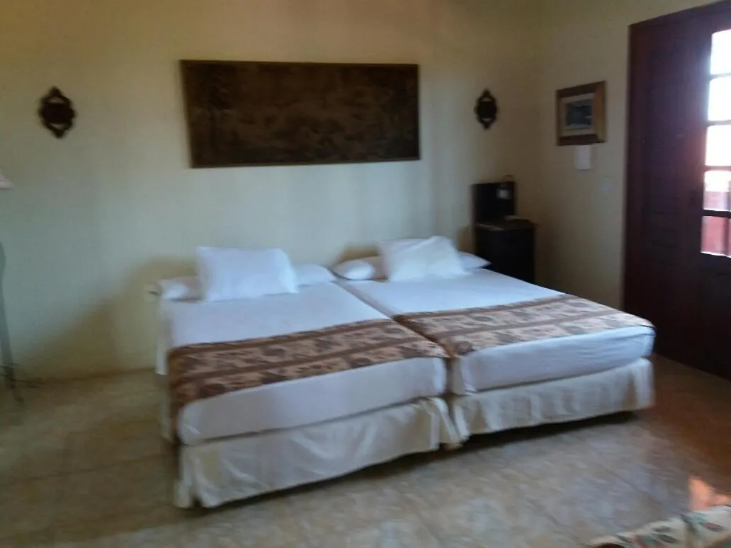 Bed in Pousada Cultural Canto dos Poetas