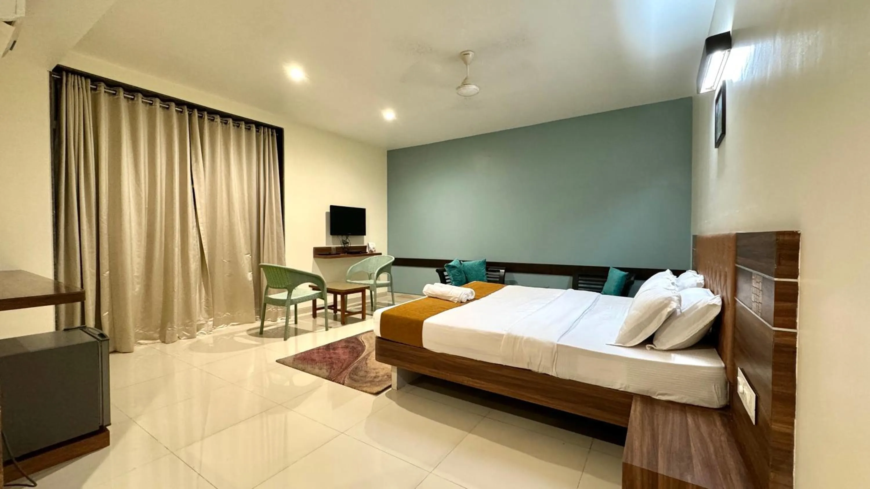 Bed in Hotel Sadhana Executive