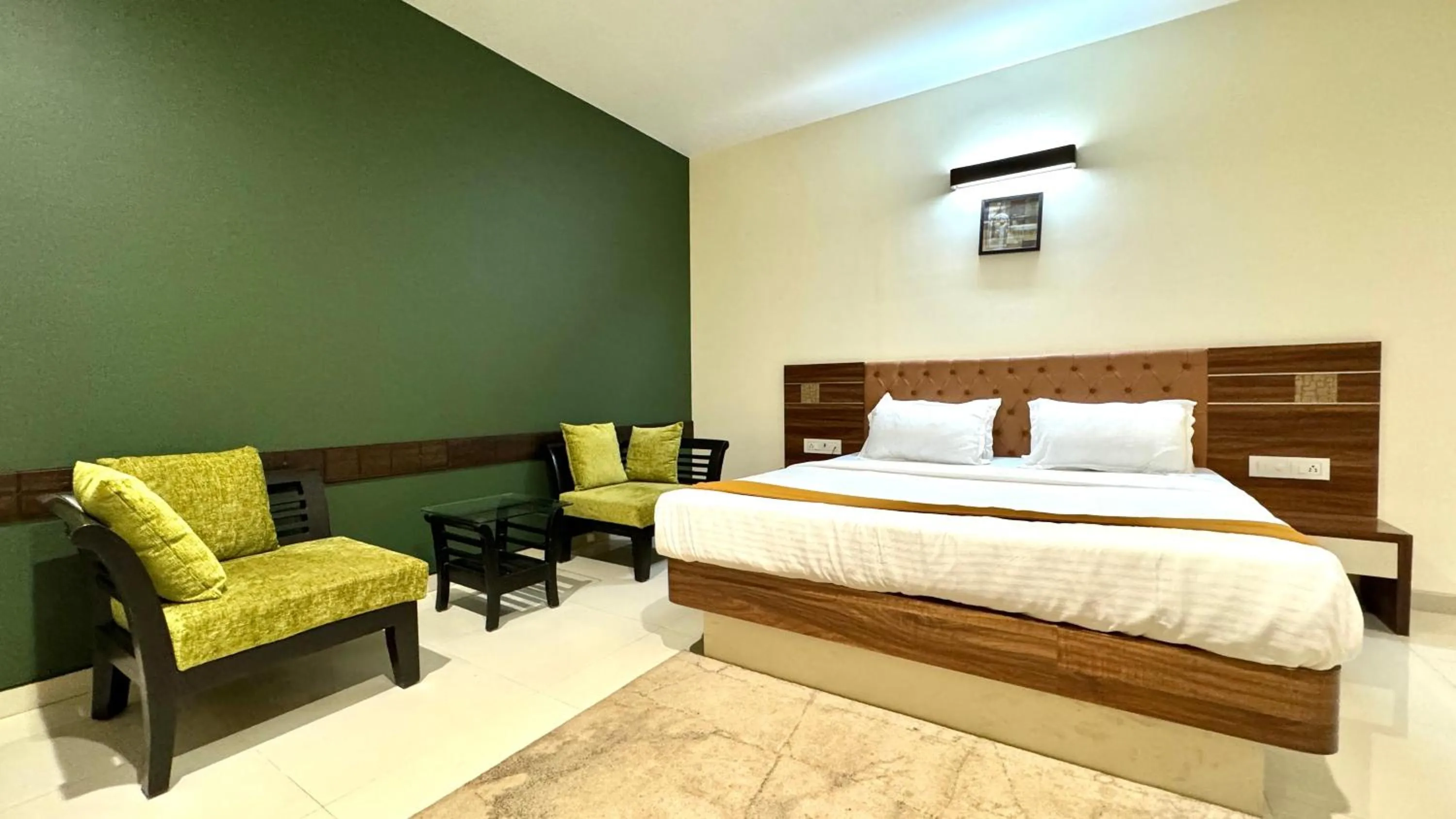 Bed in Hotel Sadhana Executive