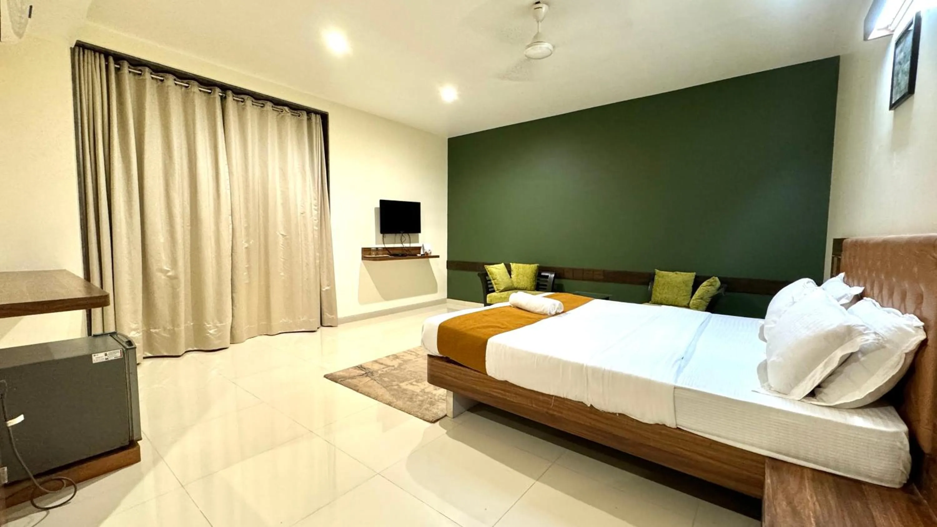 Bed in Hotel Sadhana Executive