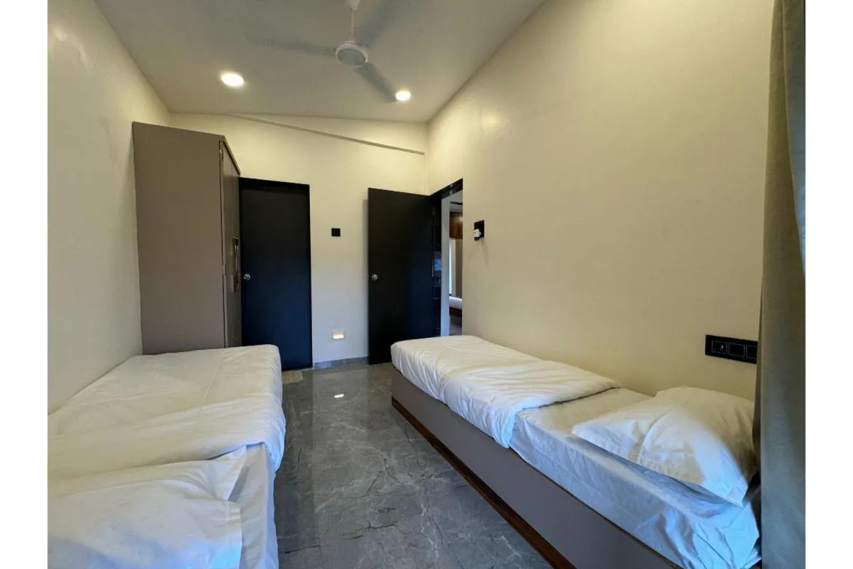 Bed in Hotel Sadhana Executive