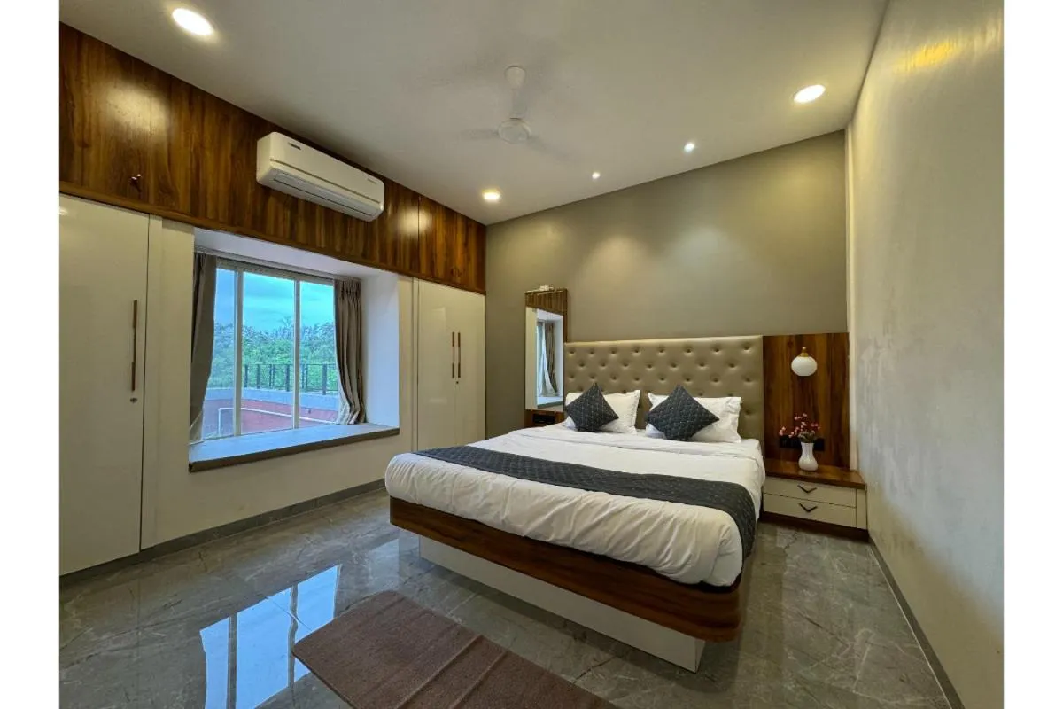 Bed in Hotel Sadhana Executive