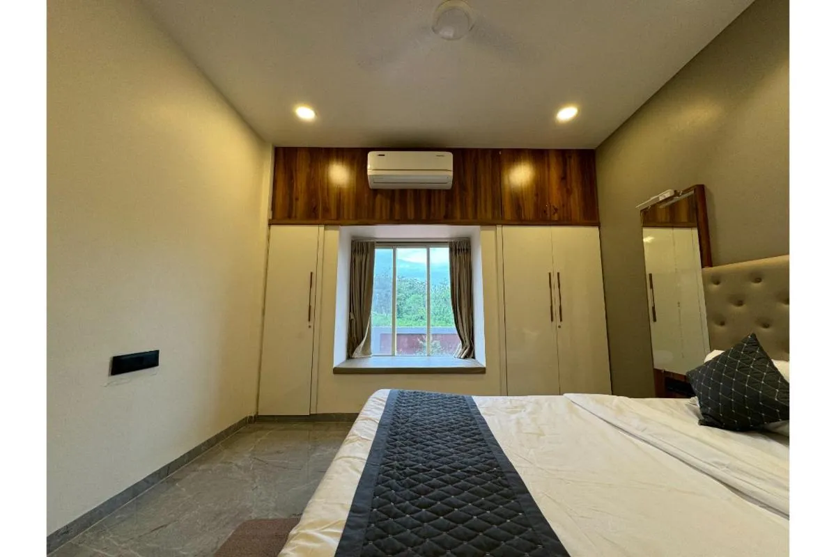 Bed in Hotel Sadhana Executive