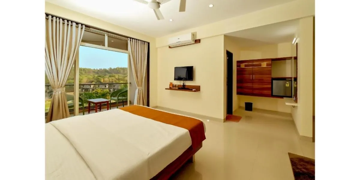 Bed in Hotel Sadhana Executive