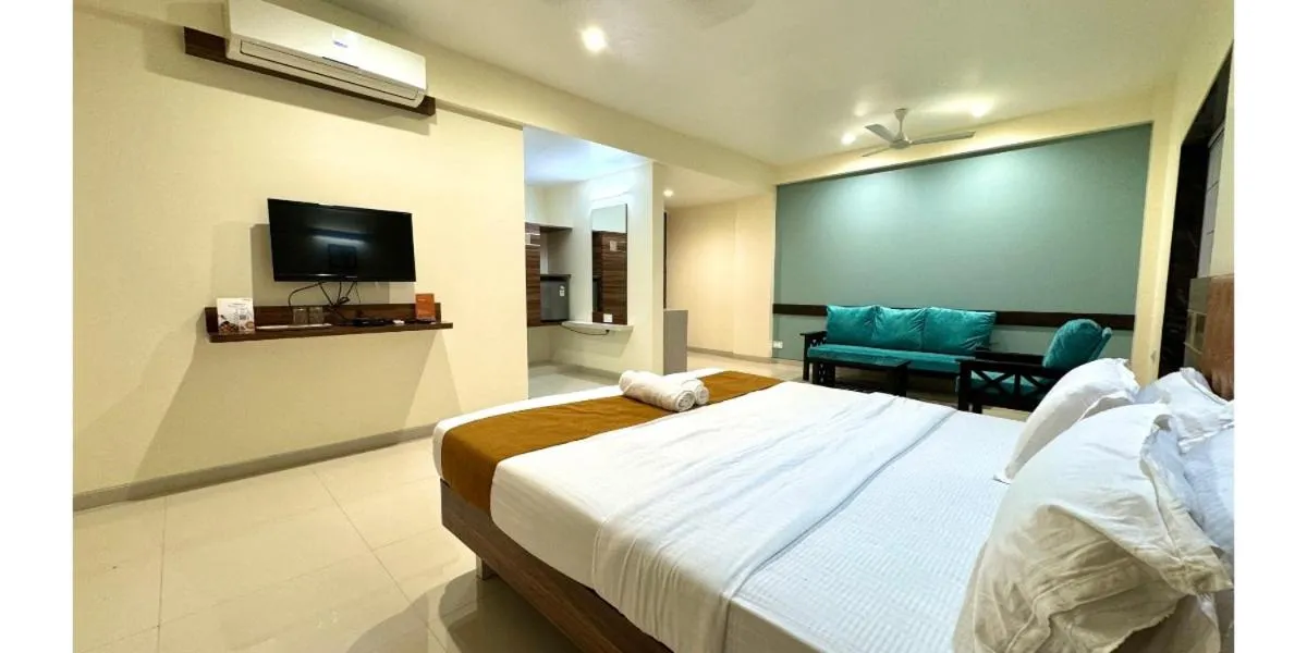 Bed in Hotel Sadhana Executive