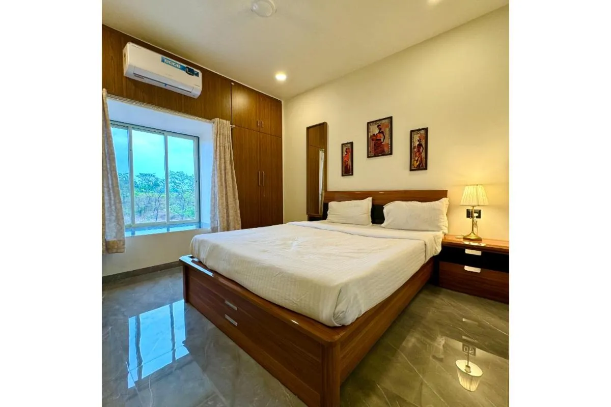 Bed in Hotel Sadhana Executive