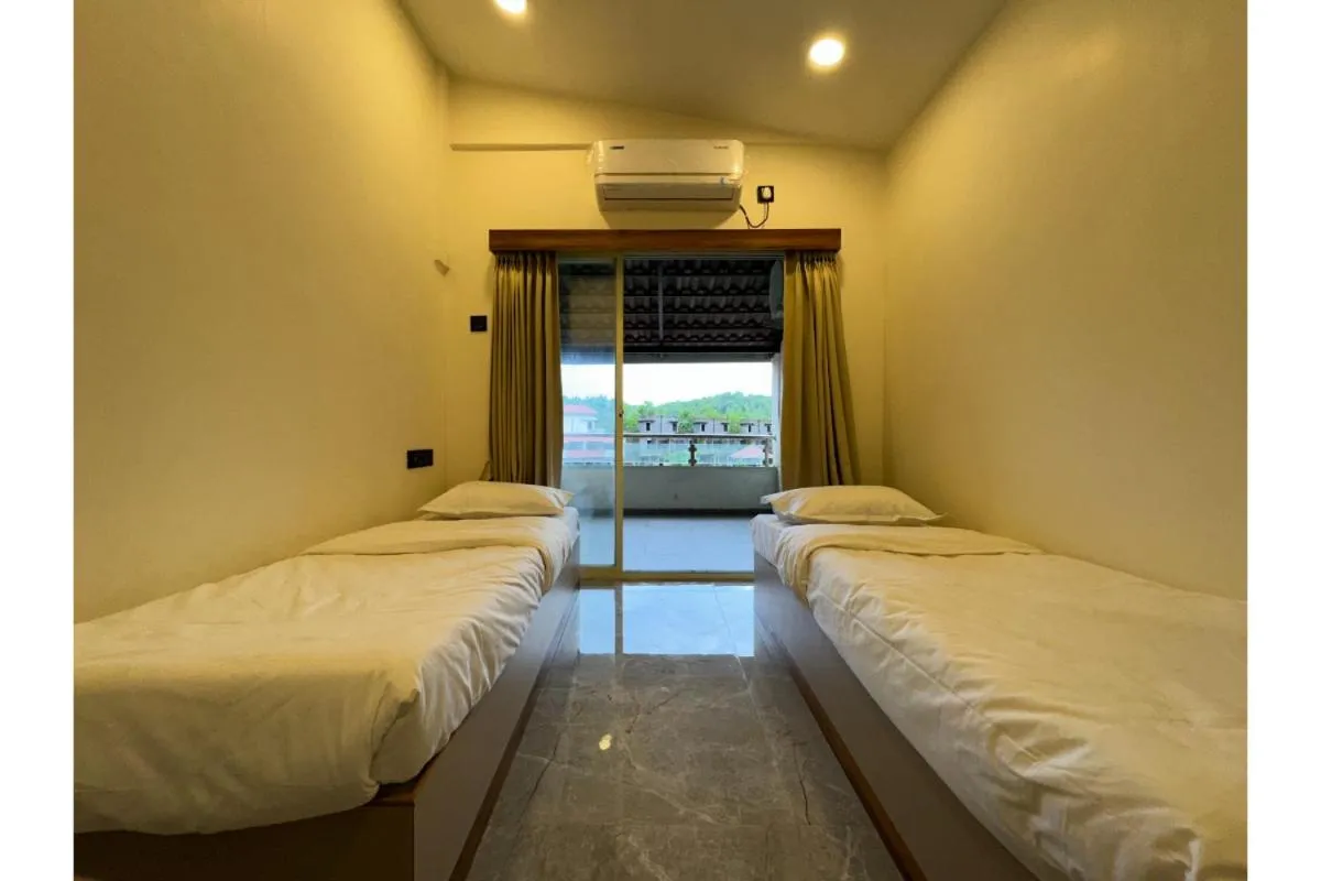 Bed in Hotel Sadhana Executive