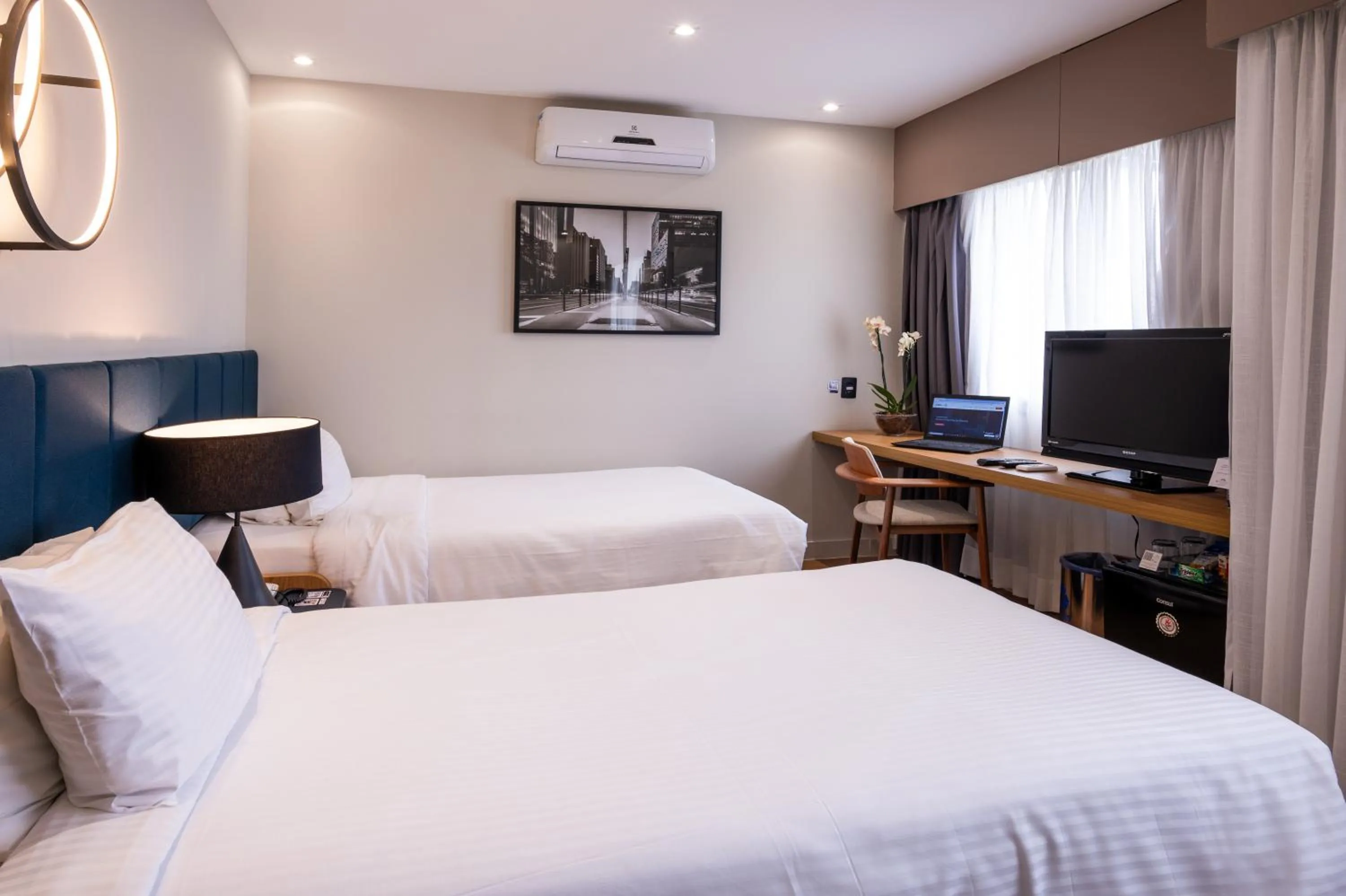 Bed in eSuítes Congonhas by Atlantica