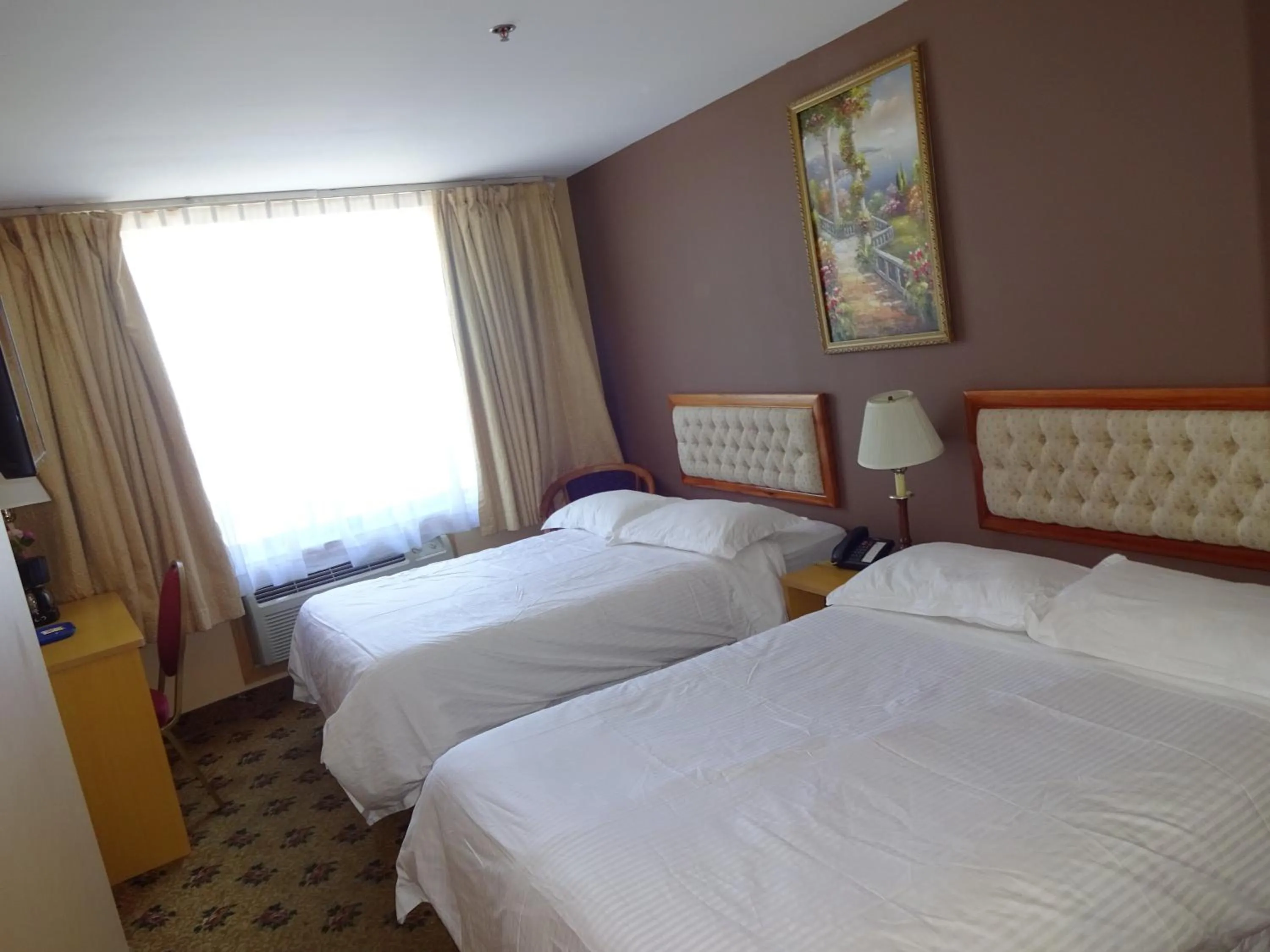 Bed in Flushing Hotel