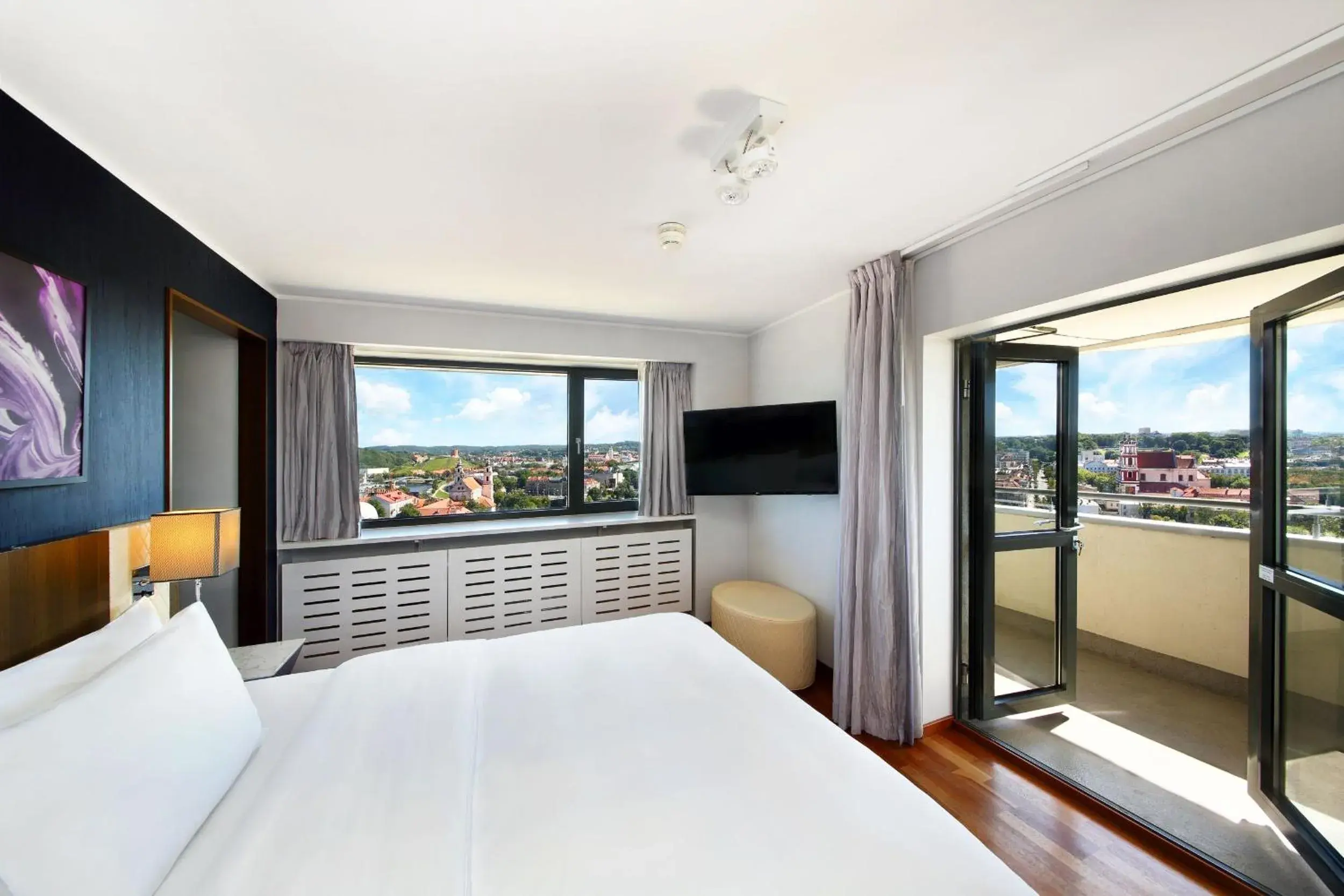 Balcony/Terrace, Bed in Radisson Blu Hotel Lietuva Balcony/Terrace, Bed in Radisson Blu Hotel Lietuva