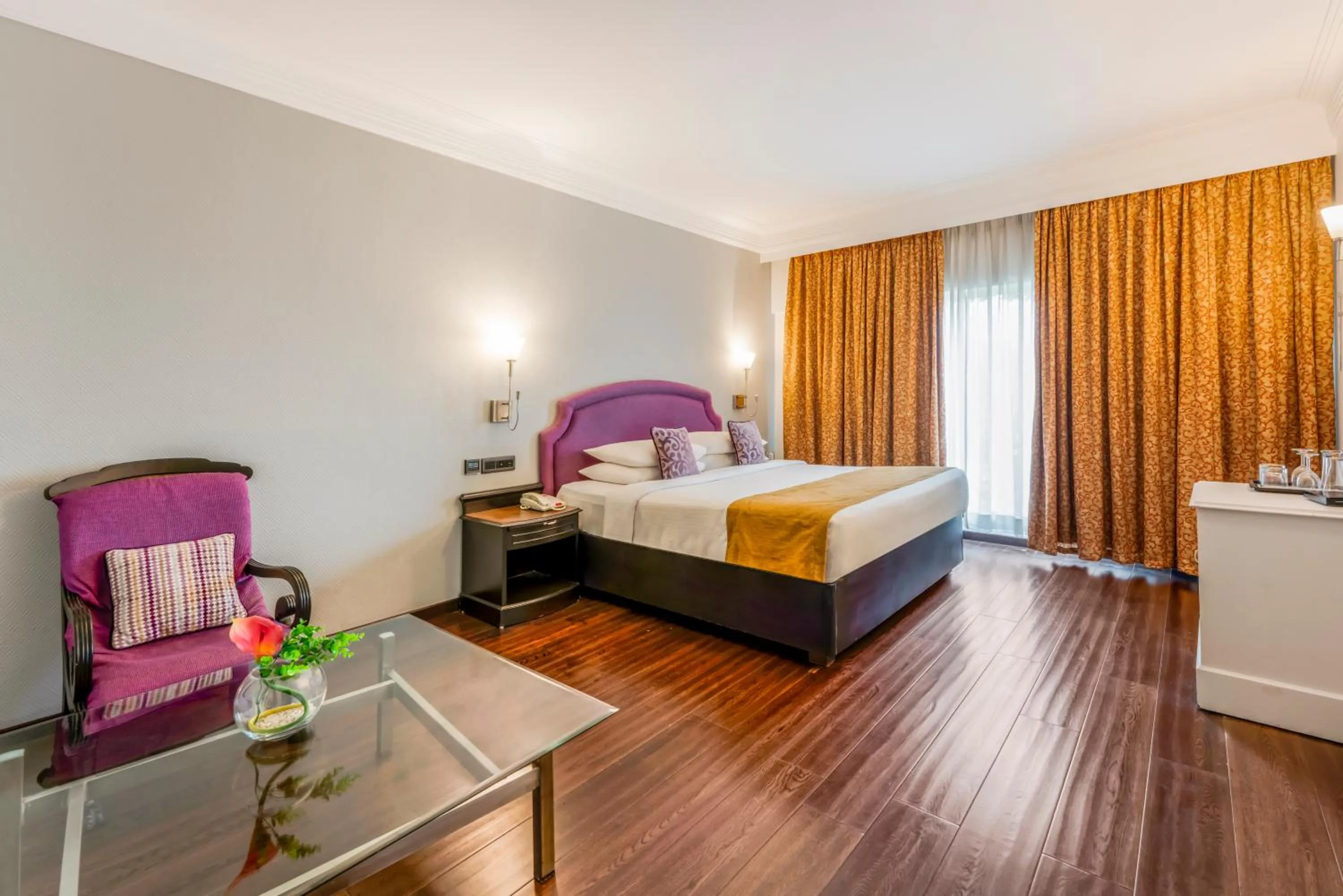 Living room, Bed in Hotel Royal Orchid Bangalore