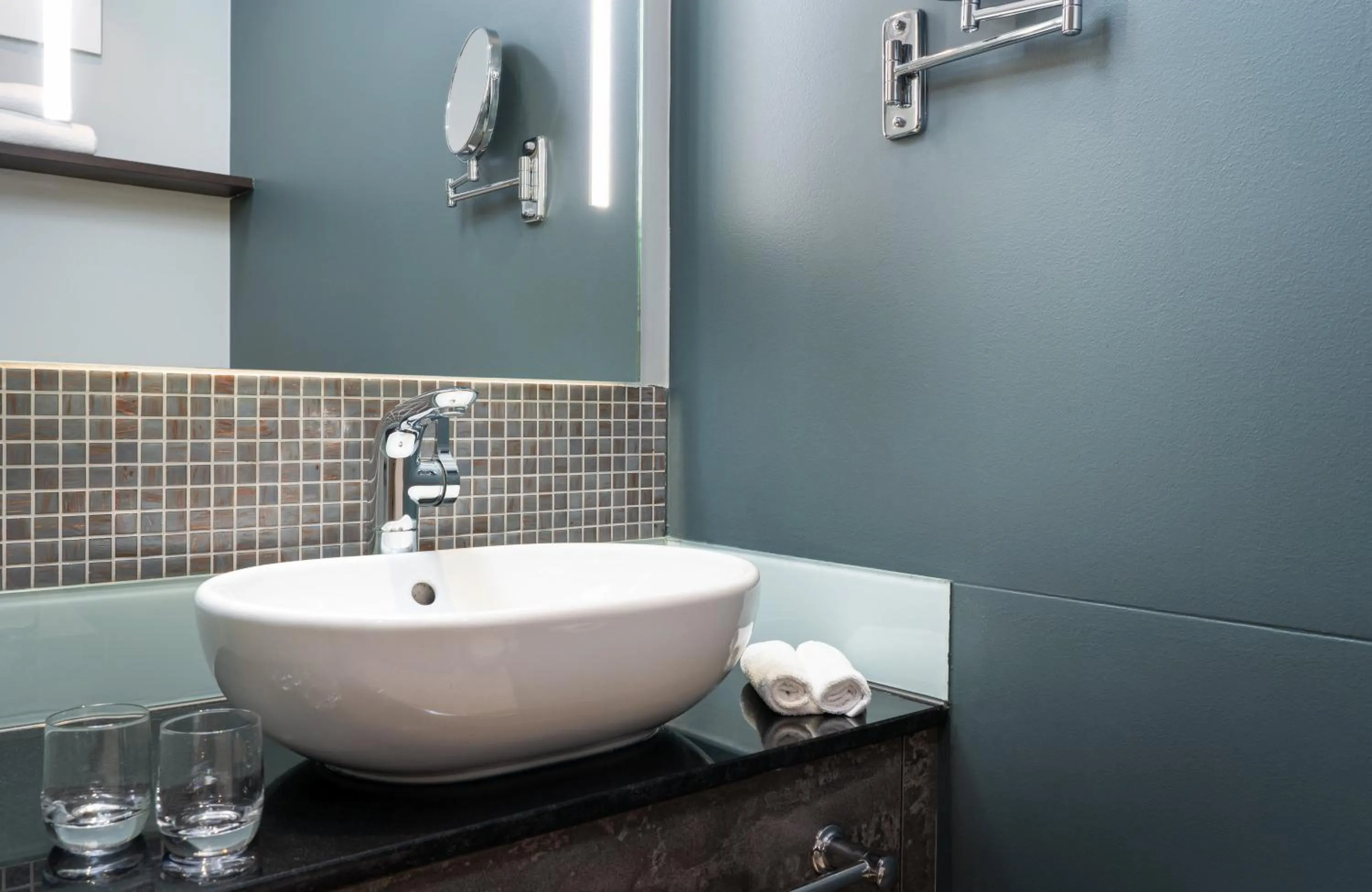 Bathroom in Leonardo Royal Hotel Munich