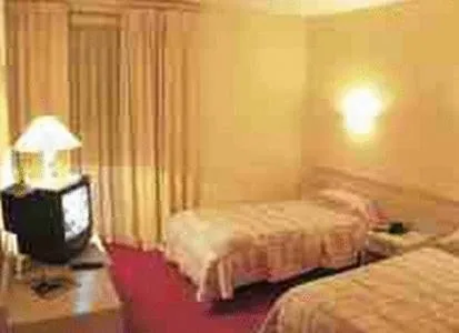 Photo of the whole room, Bed in Le Central