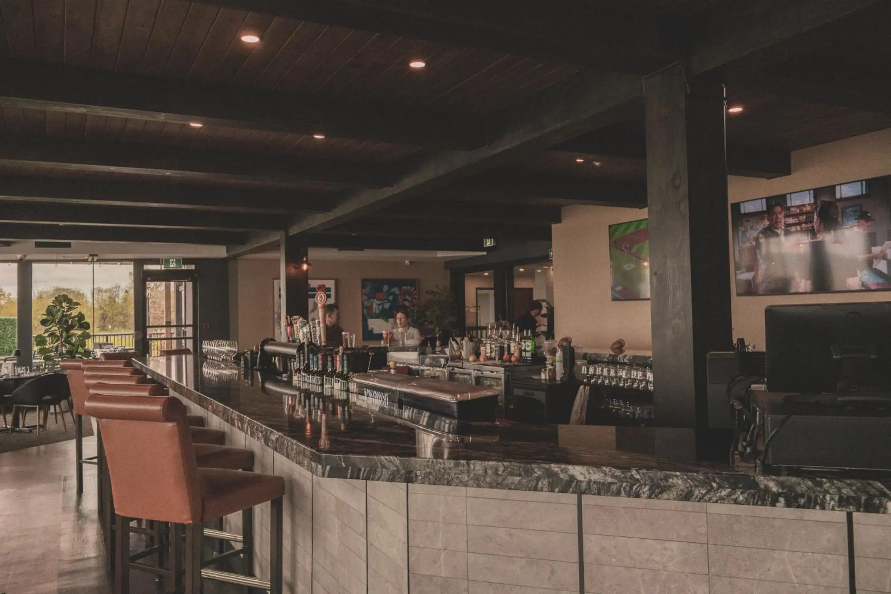 Lounge or bar in The Jordan Hotel Ramada by Wyndham Lounge or bar in The Jordan Hotel Ramada by Wyndham