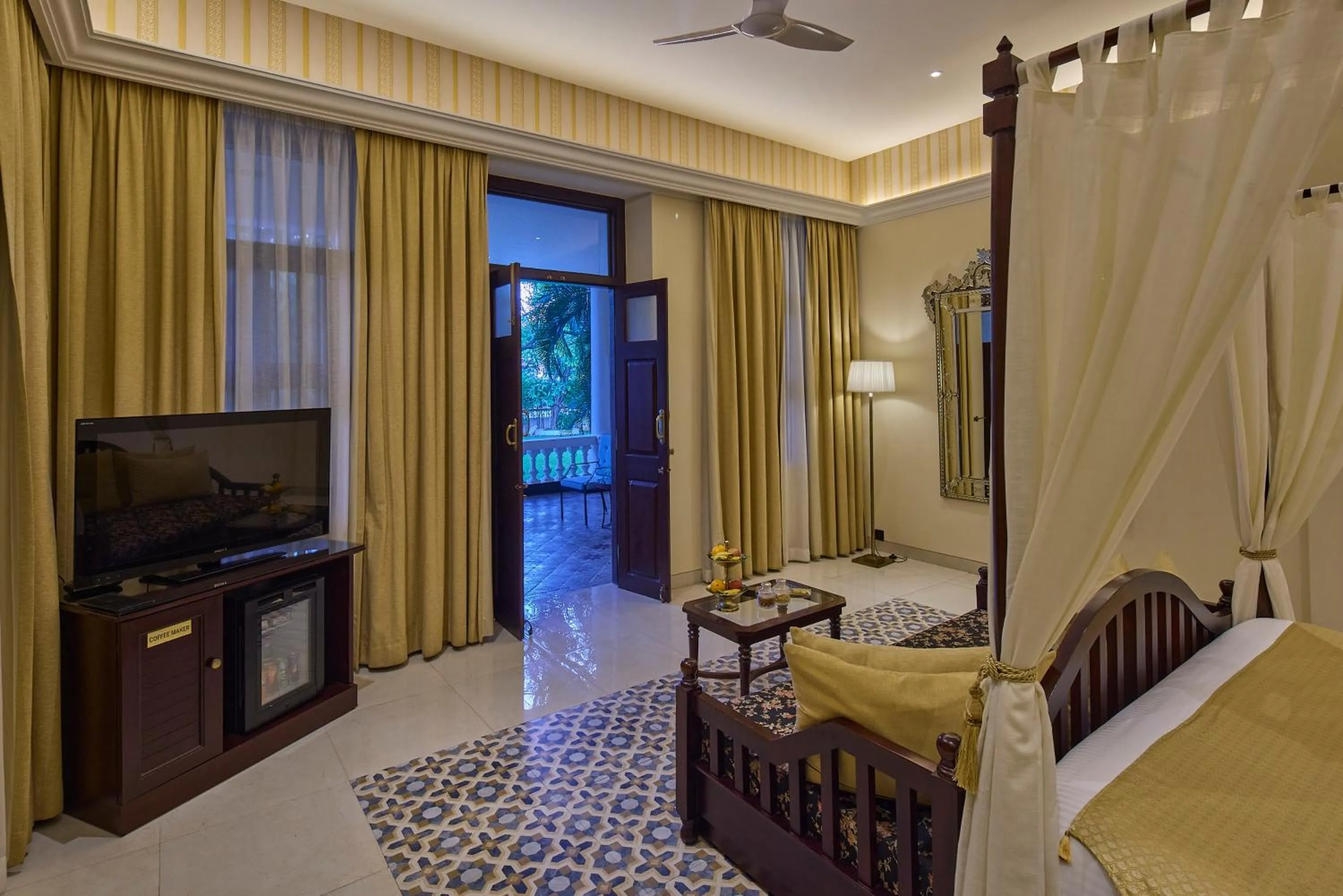 Communal lounge/ TV room, Bed in Royal Orchid Metropole Mysore
