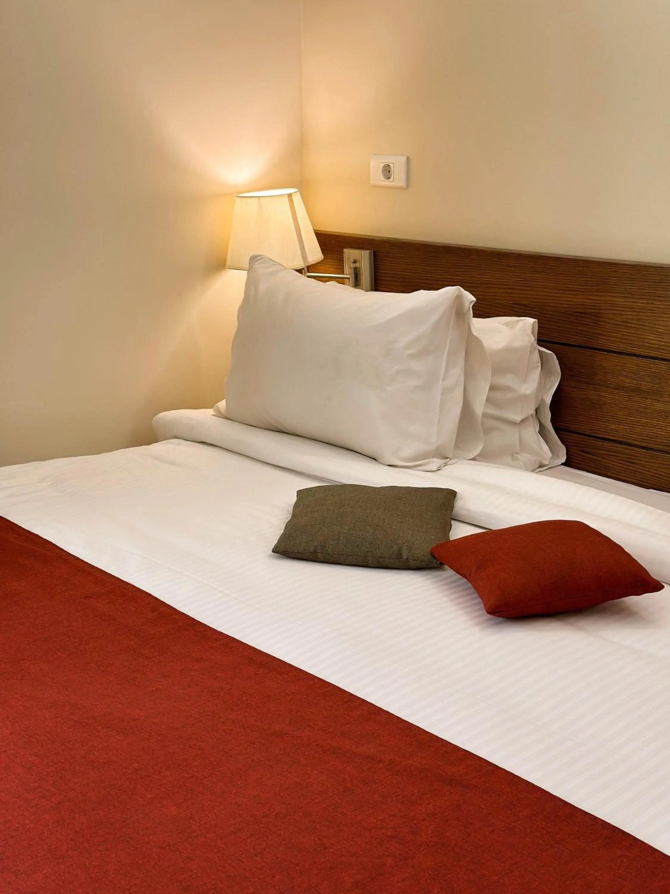 Bed in Cosmopolitan Hotel