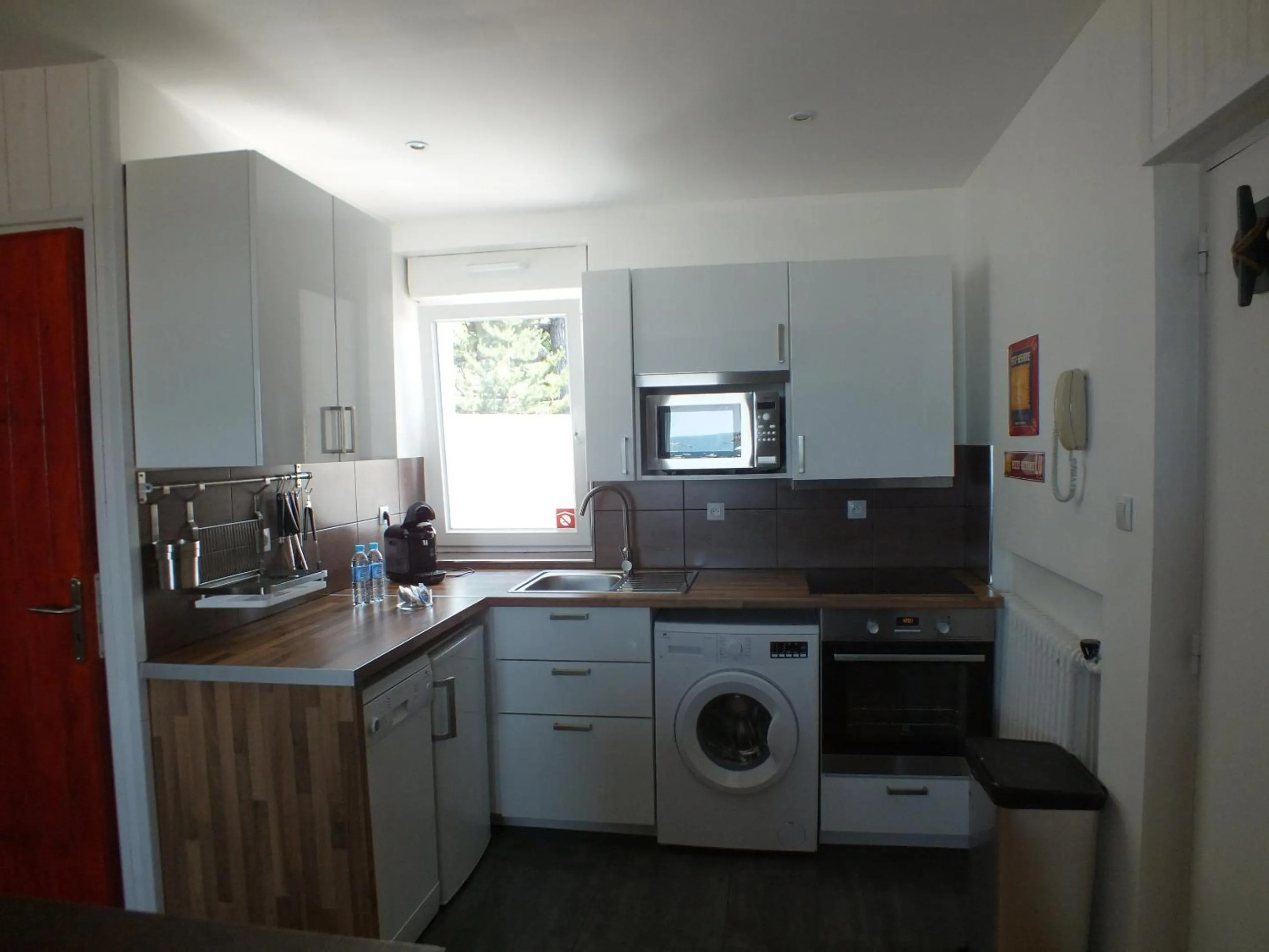 Kitchen or kitchenette in Hôtel Le Beauséjour