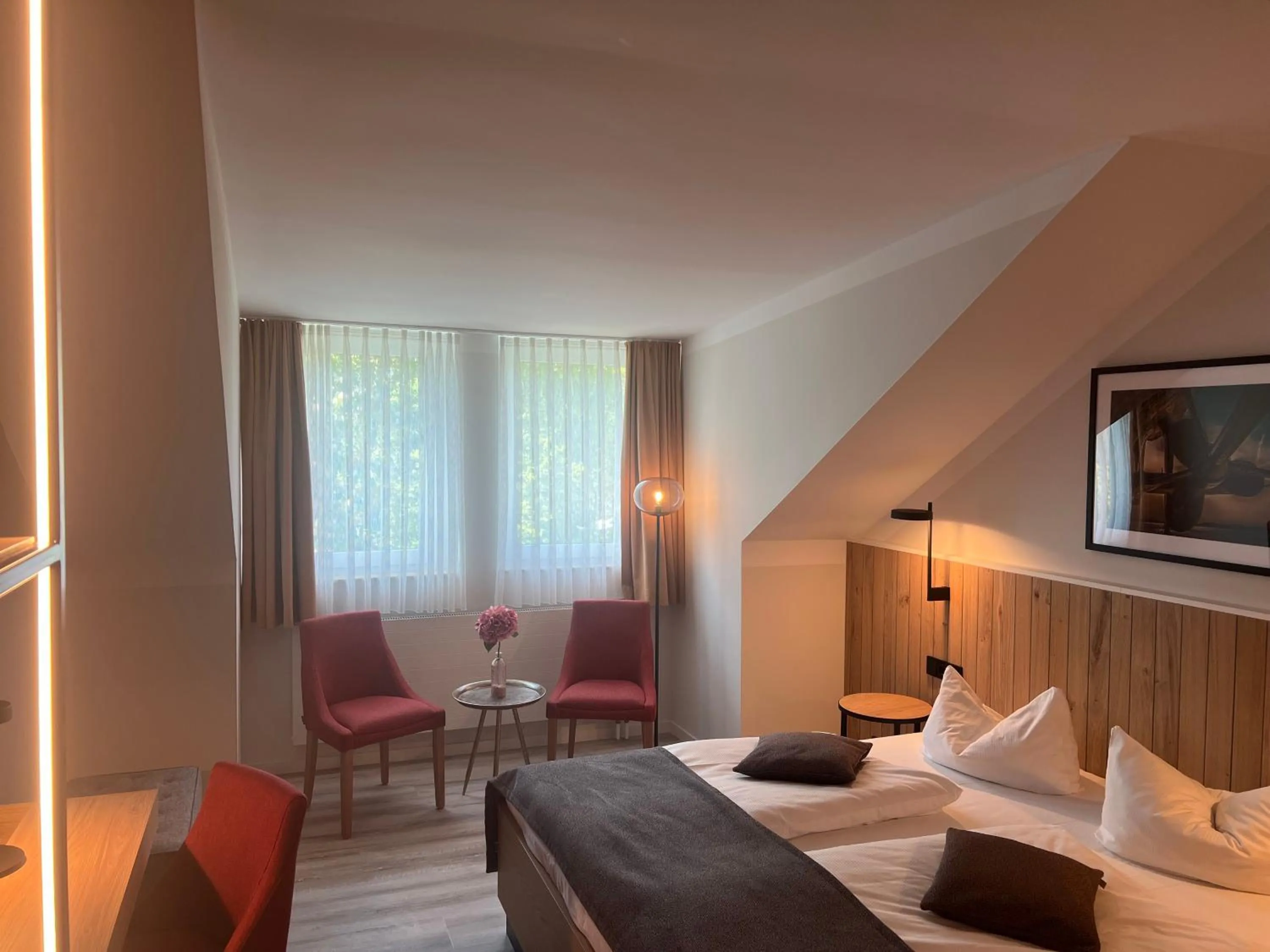 Photo of the whole room, Bed in Atrium Hotel Krüger