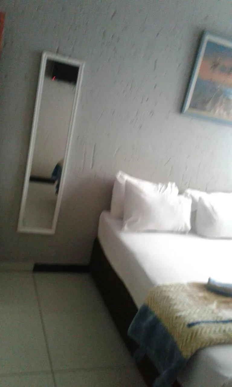 Bed in Royal Crown Guesthouse