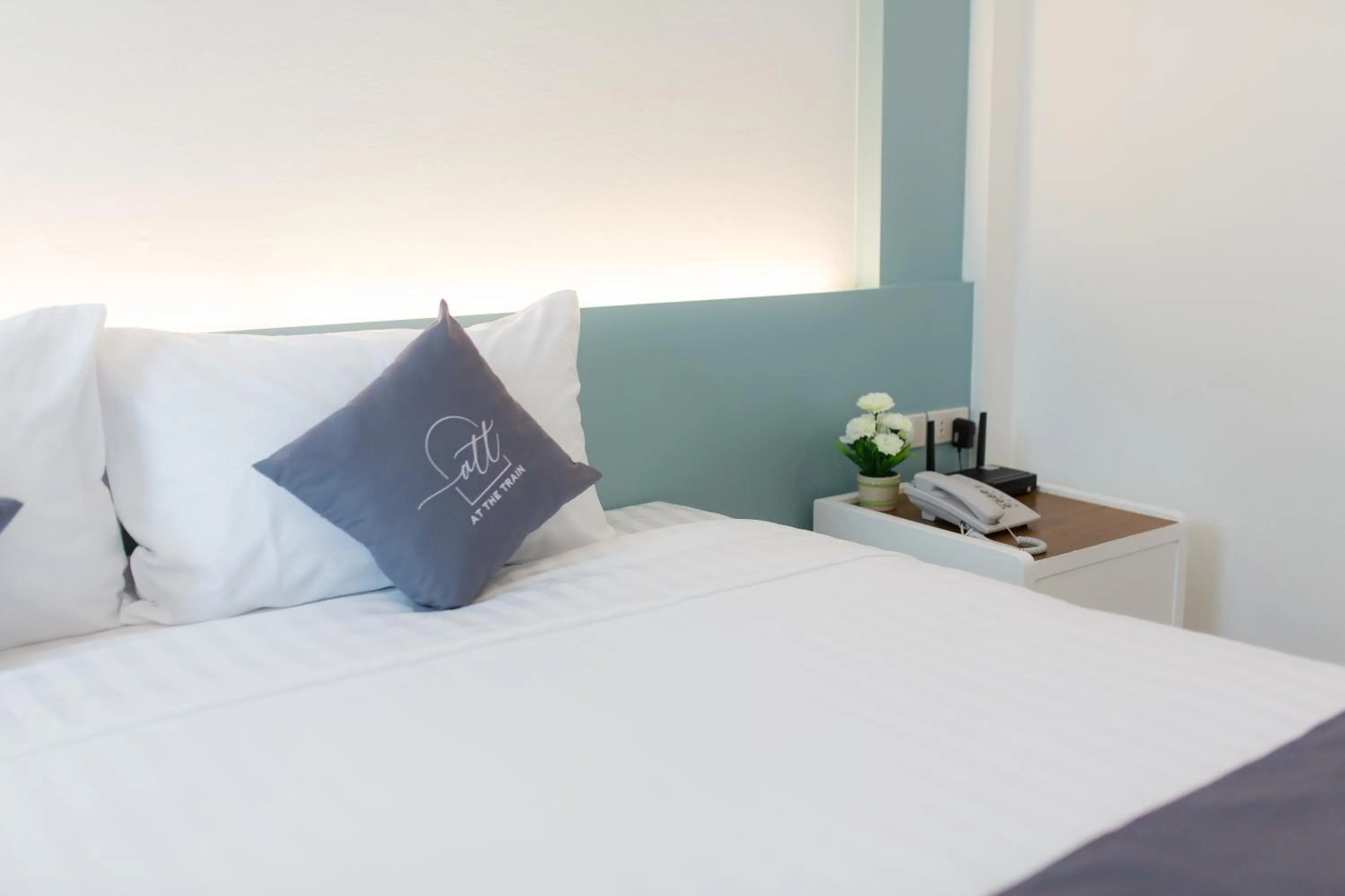 Bed in At the Train Chiang Mai Hotel